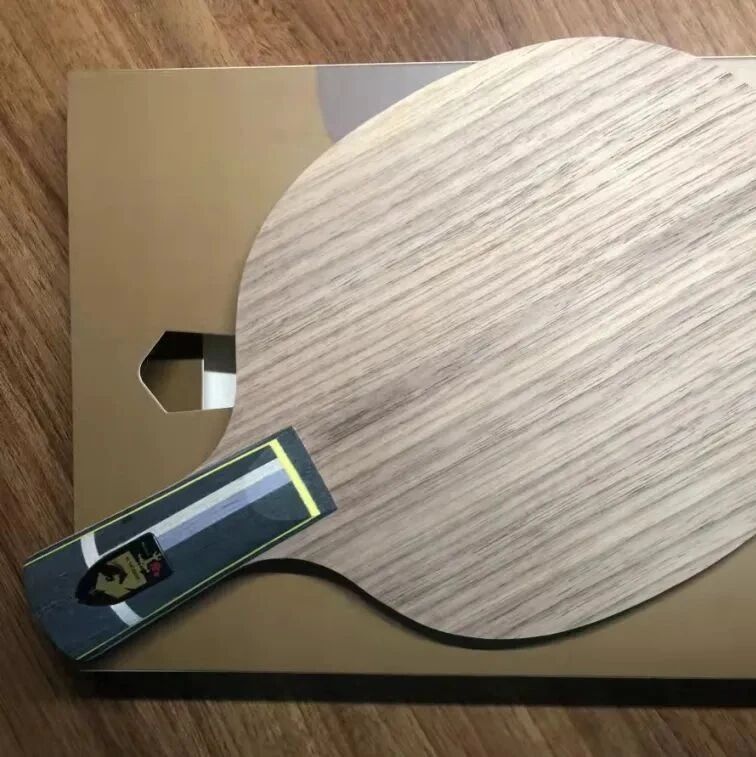 Three table tennis paddles with rubbers attached showing different setups